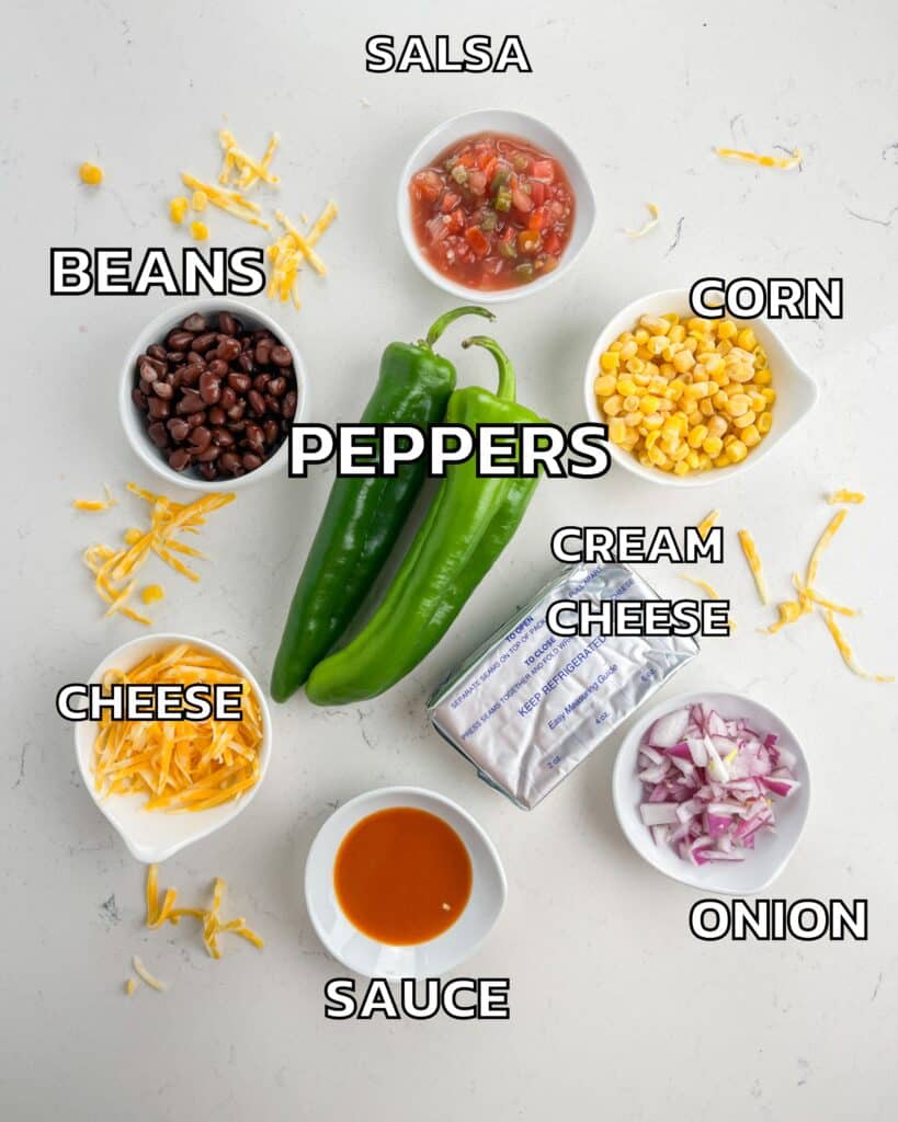 ingredients in stuffed peppers laid out on a white counter.