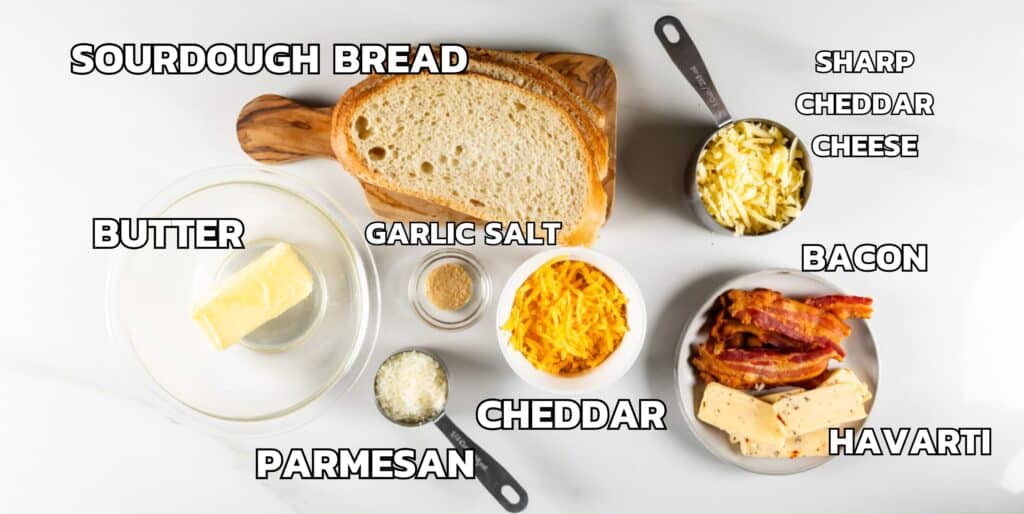 ingredients in grilled cheese laid out on a white marble counter.