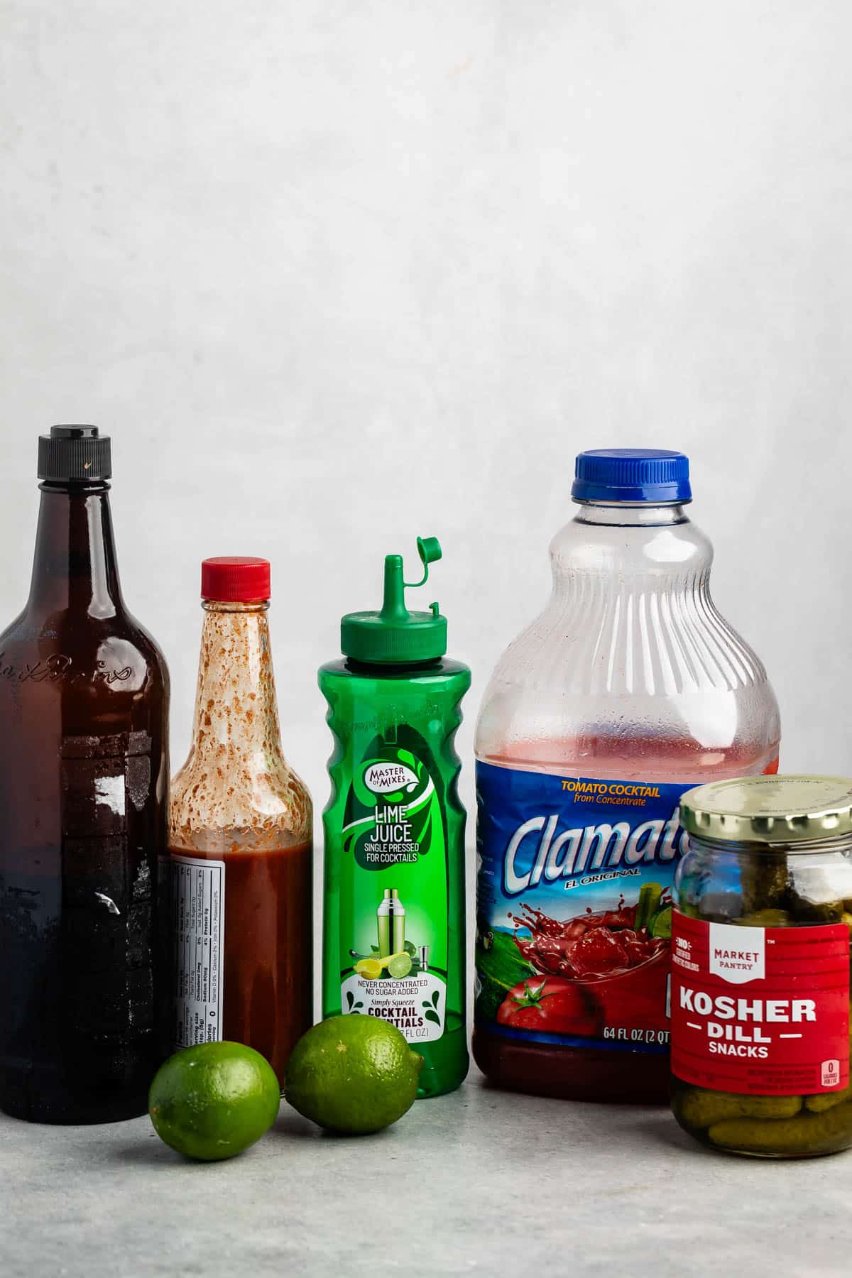 ingredients in virgin Bloody Mary laid out on a grey surface.