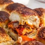 pizza sliders in a clear pan.