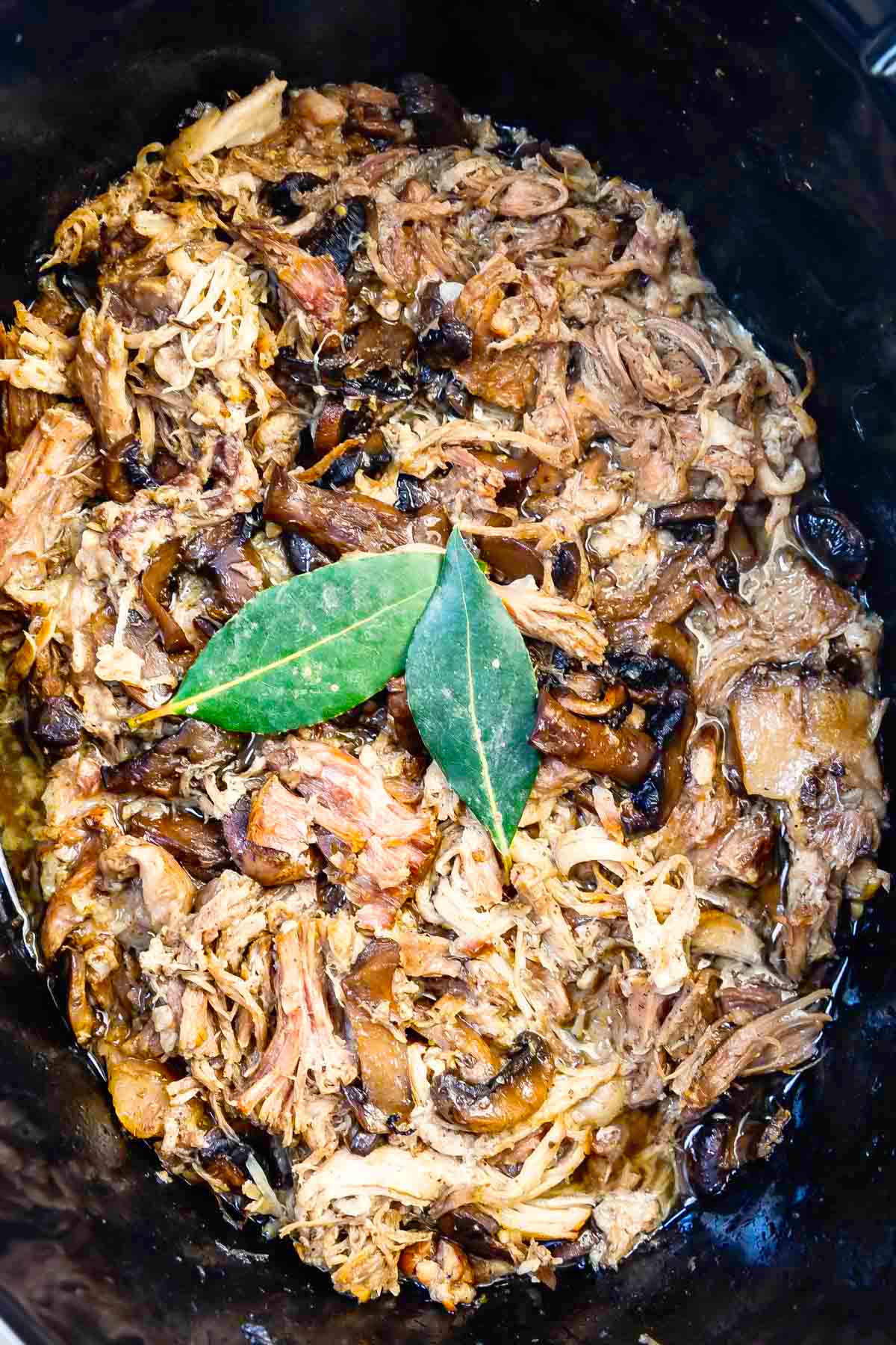 pulled pork and mushrooms in crockpot.