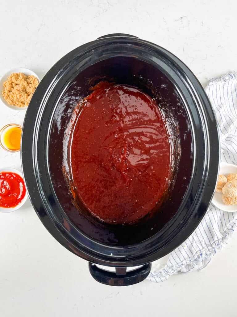 process shot of bbq meatballs being made.