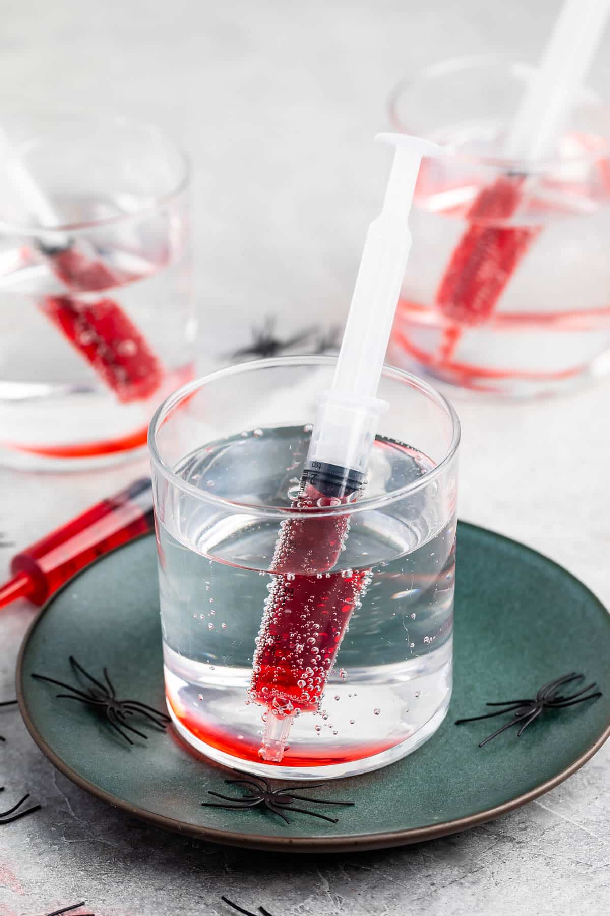 red grenedine in a plastic syringe that dipped in a clear glass of sprite.