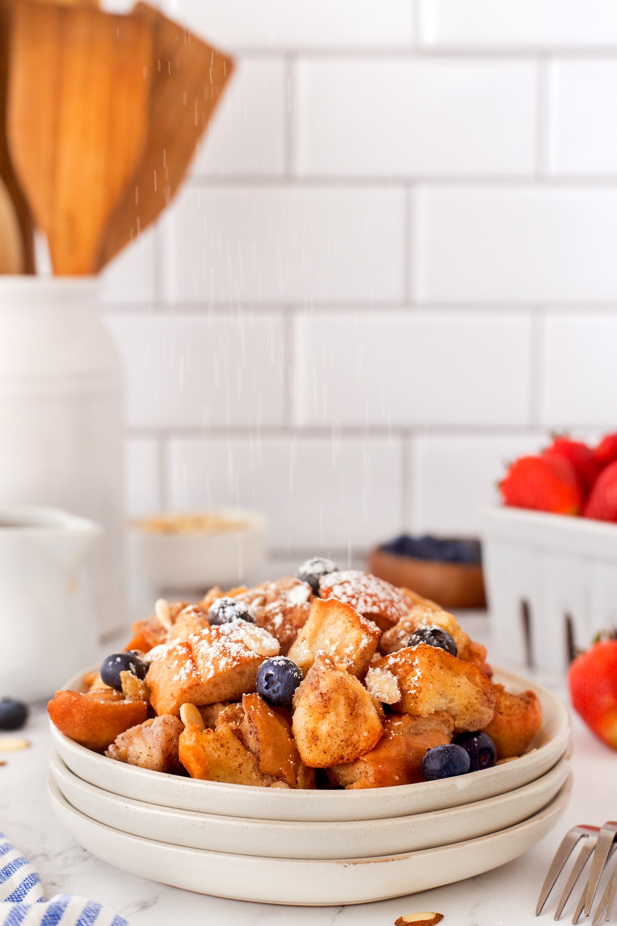 French bread covered in blueberries and syrup.