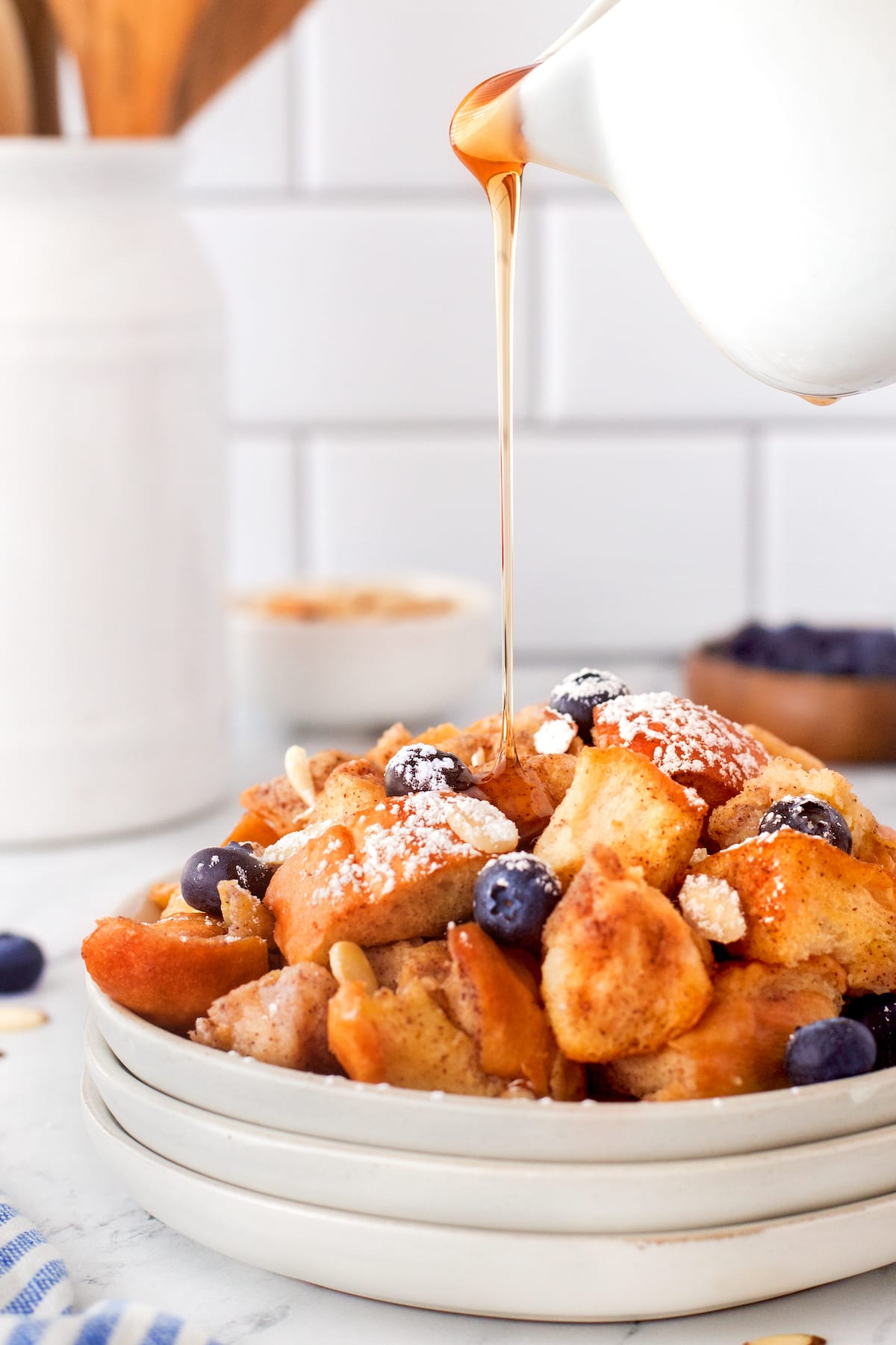 French bread covered in blueberries and syrup.