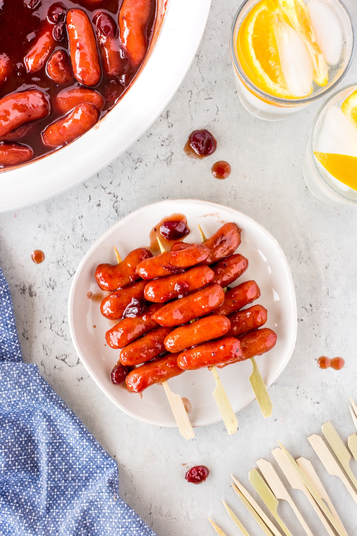 little smokies covered in sauce on a skewer.