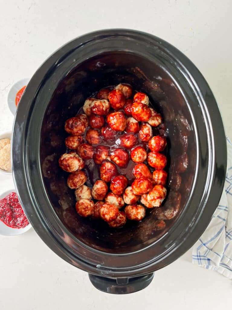 process shot of jelly meatballs being made.