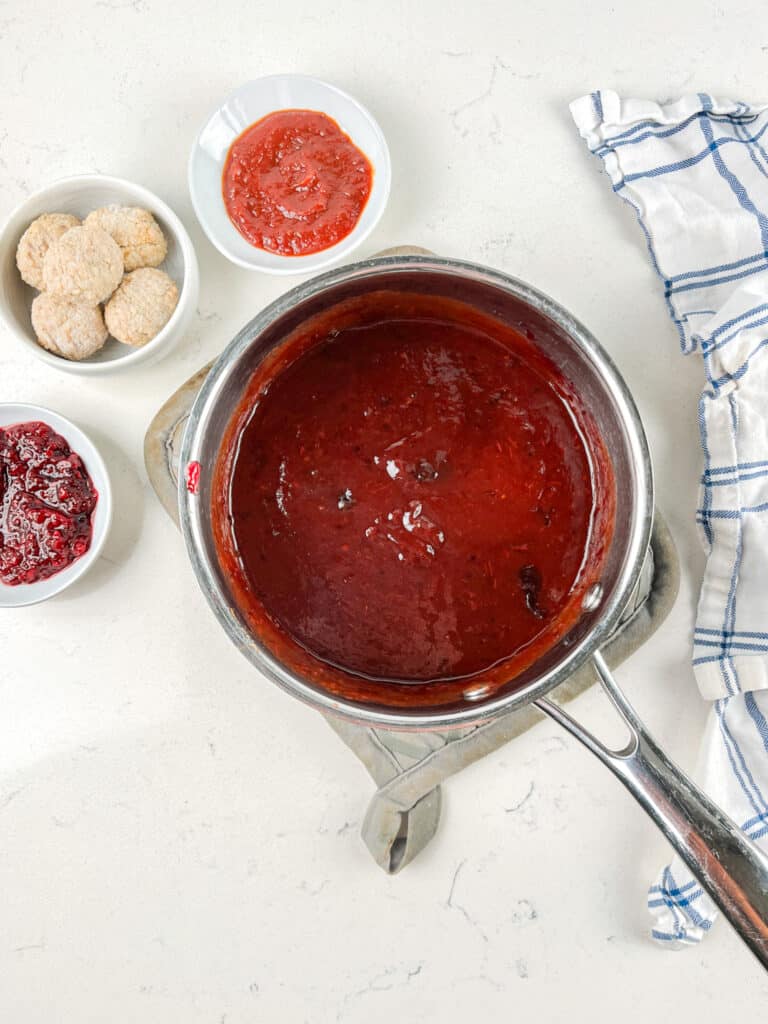 process shot of jelly meatballs being made.