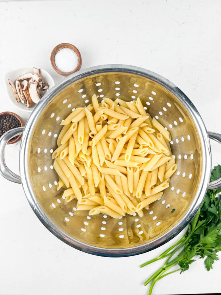 process shot of mushroom pasta being made.