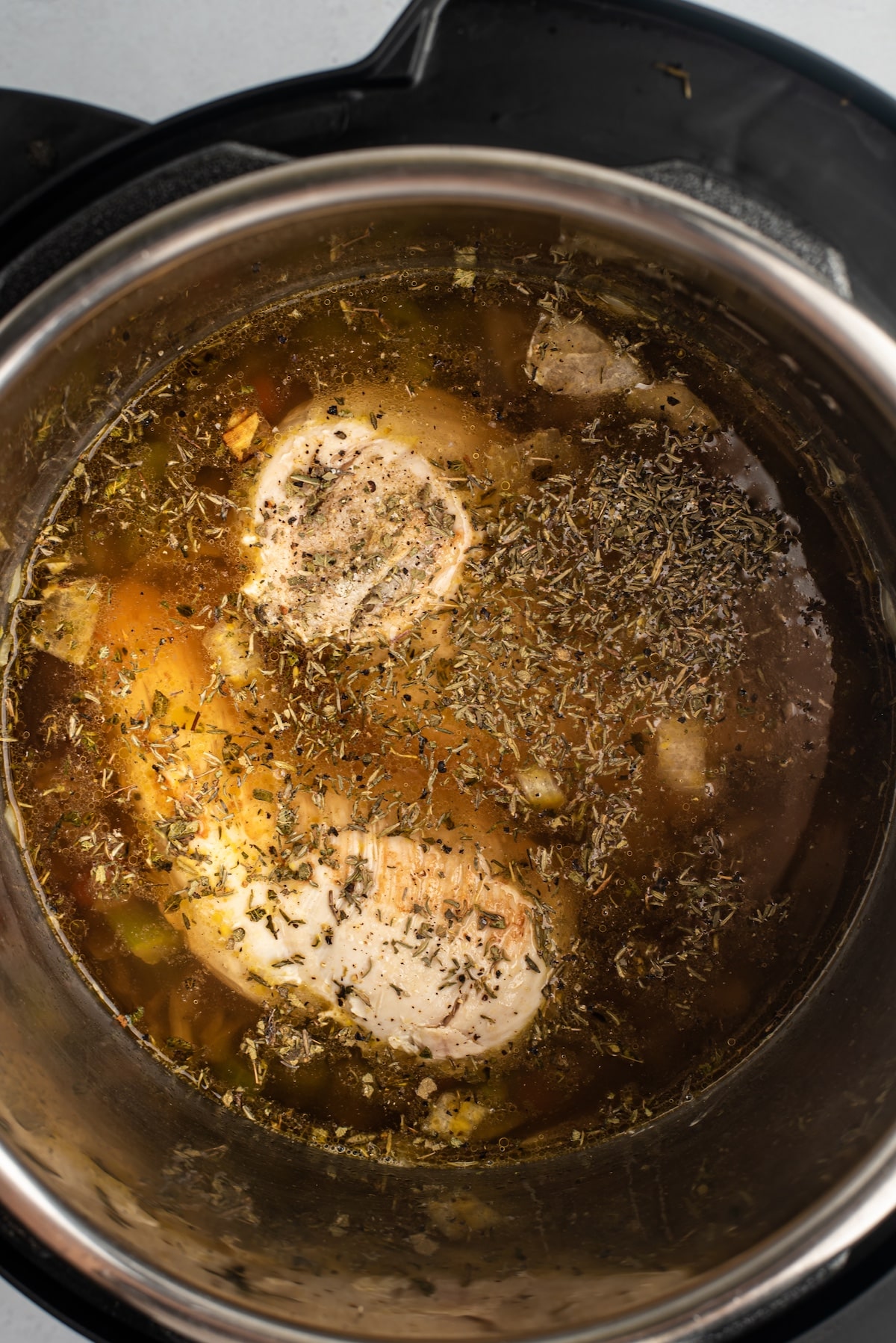 process shot of instant pot chicken and dumplings being made.