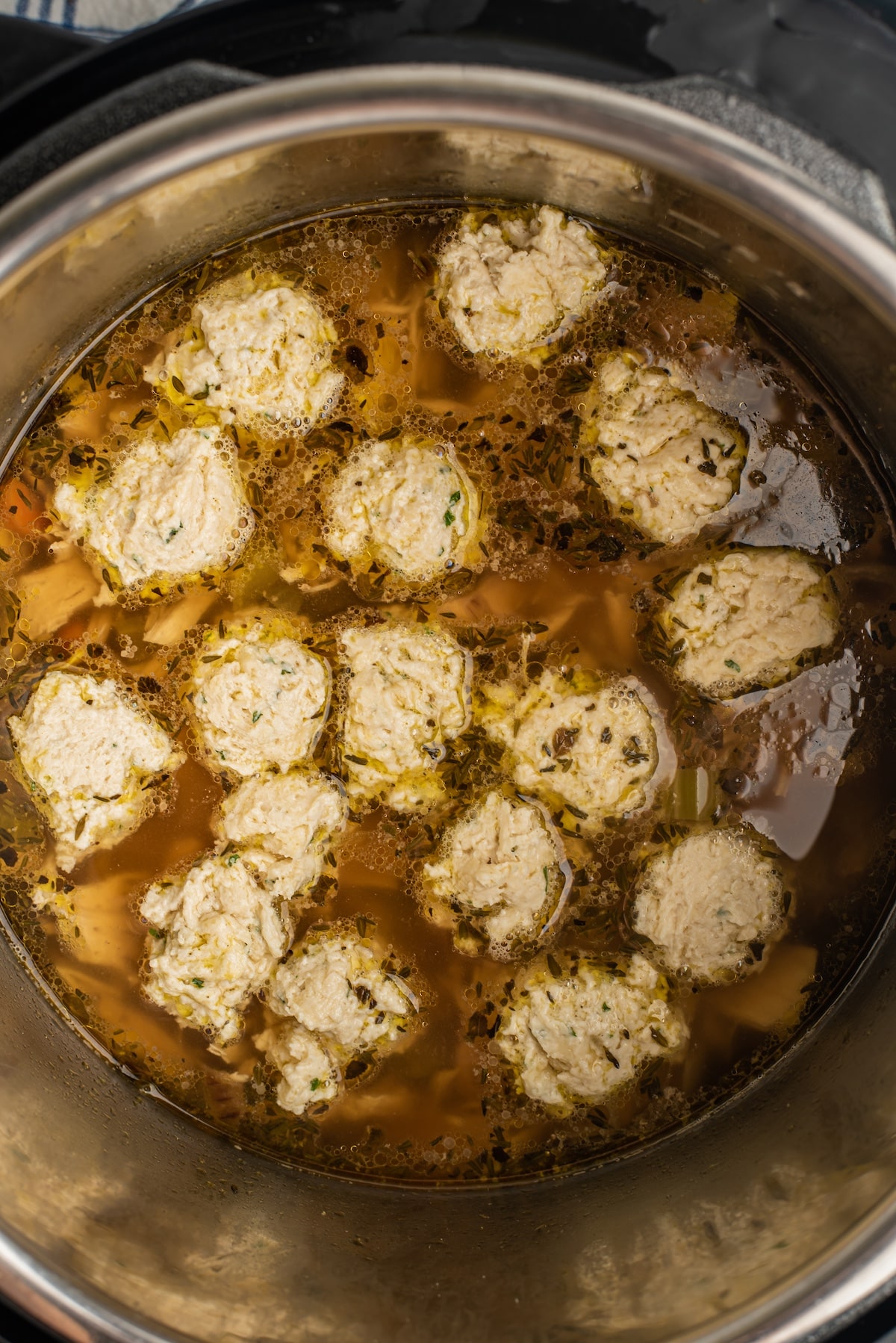 process shot of instant pot chicken and dumplings being made.