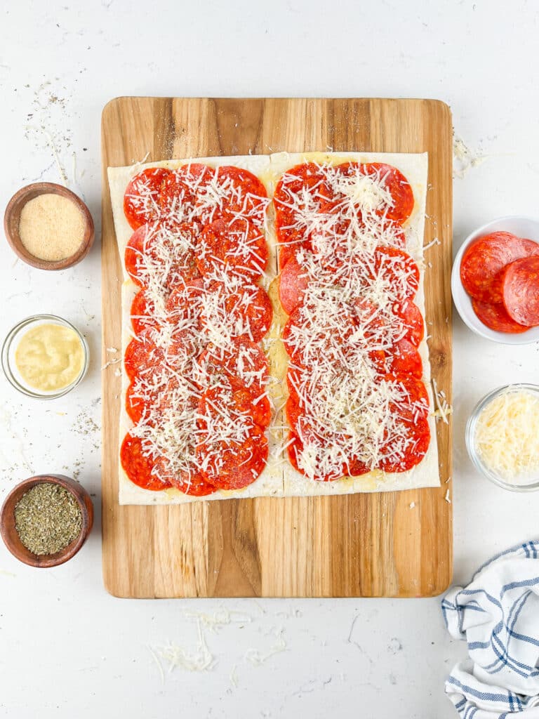 process shot of pizza pinwheels being made.