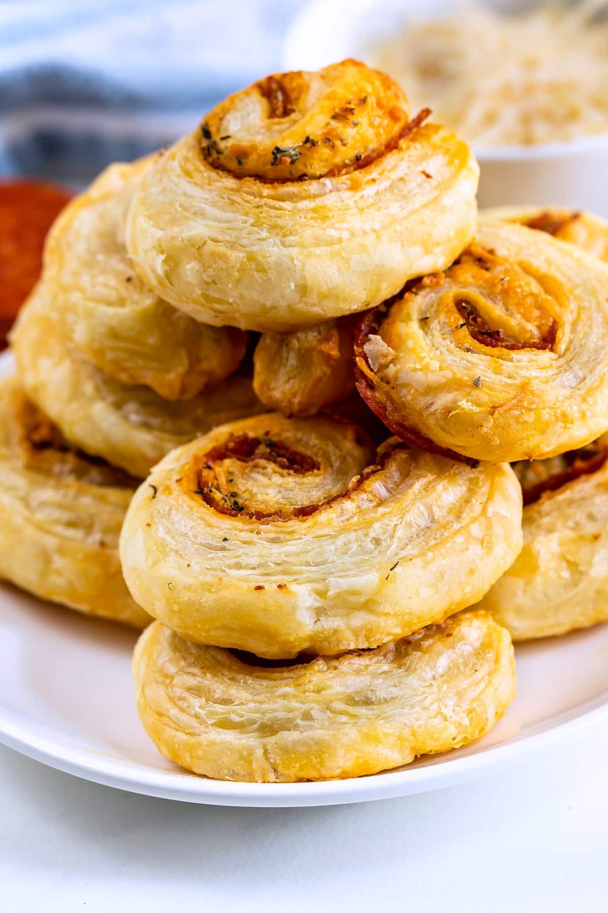 stacked pinwheels on a white plate.