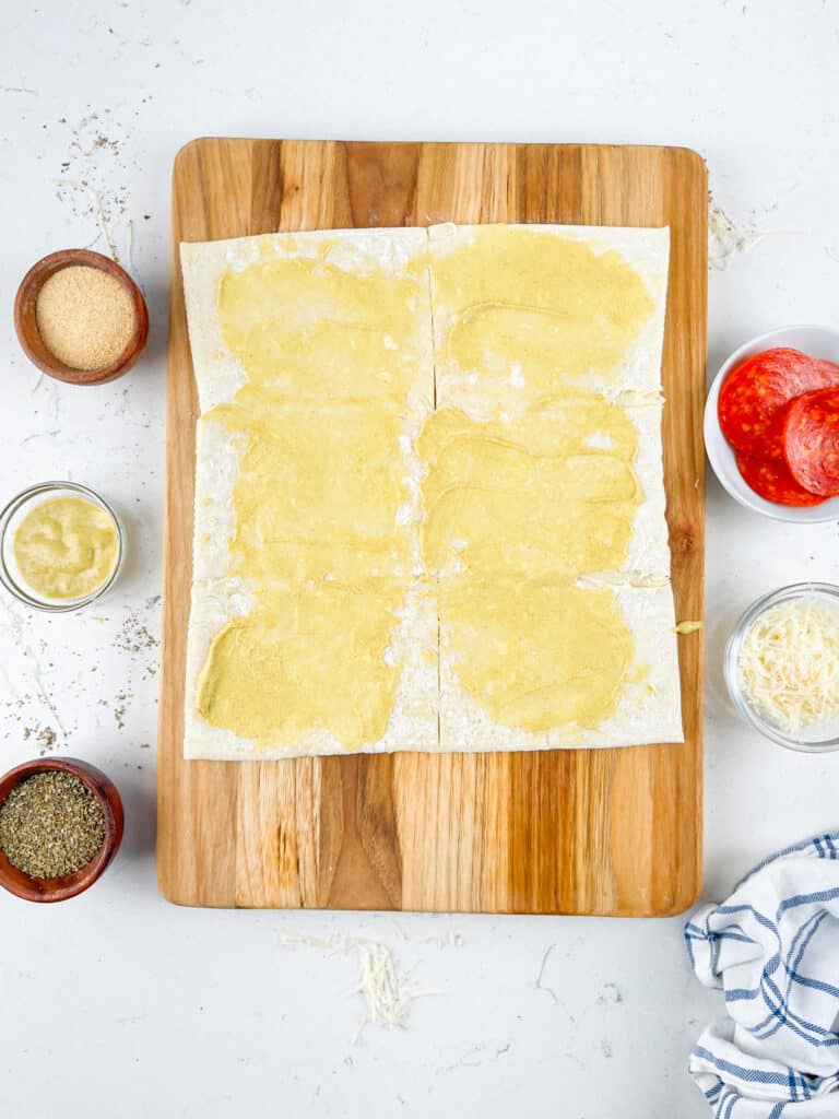 process shot of pizza pinwheels being made.