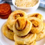 stacked pinwheels on a white plate.