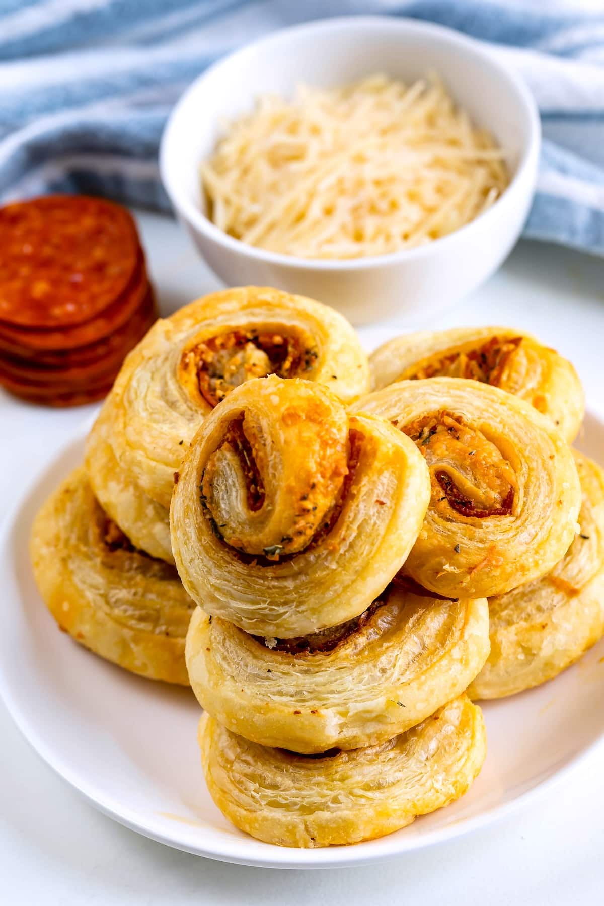 stacked pinwheels on a white plate.