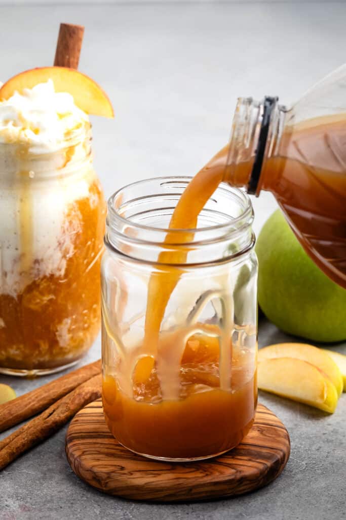 process shot of apple cider float being made.