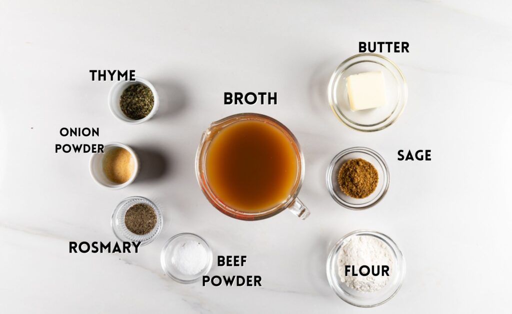 ingredients in brown gravy laid out on a white counter.