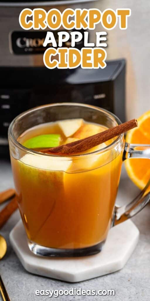 apple cider mixed with apples and cinnamon sticks and orange slices with words on the image.