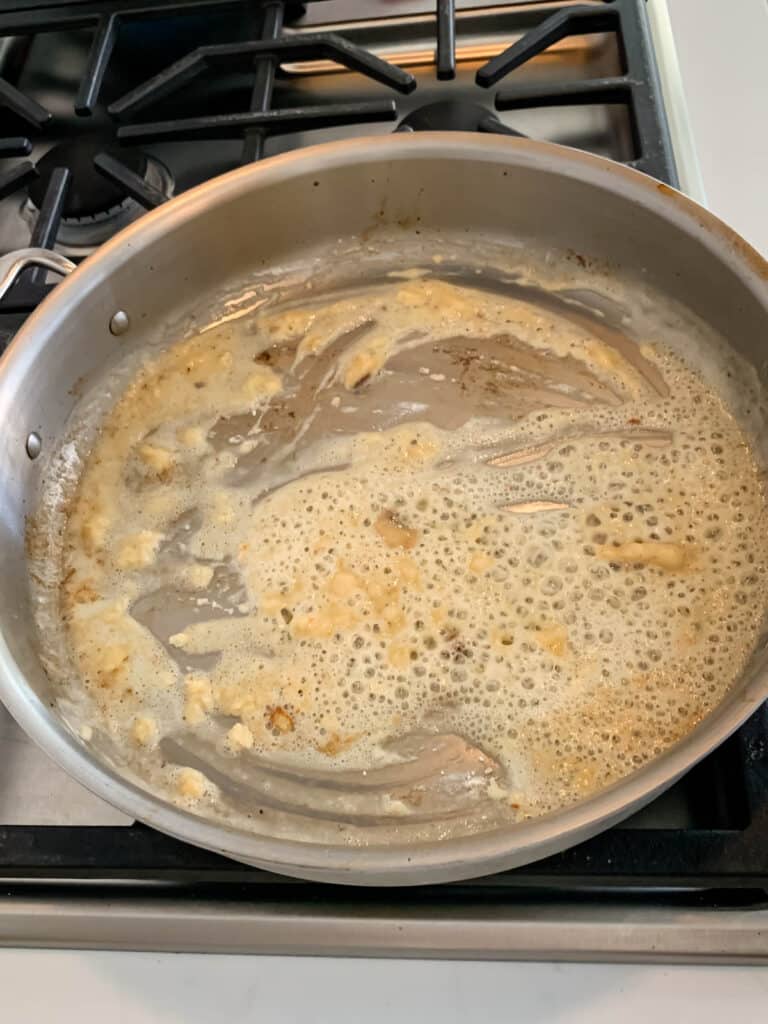 process shot of brown gravy being made.