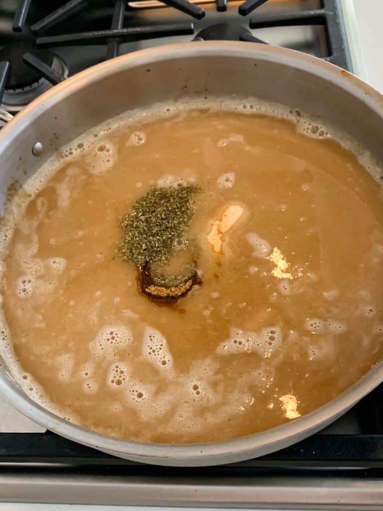 process shot of brown gravy being made.