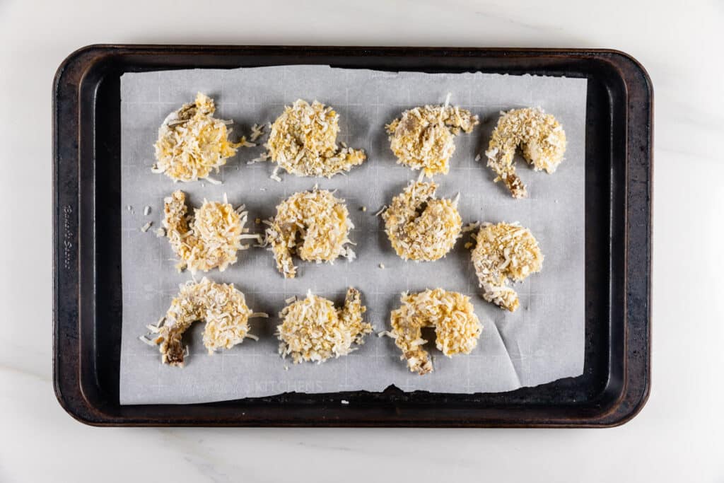 process shot of coconut shrimp being made.