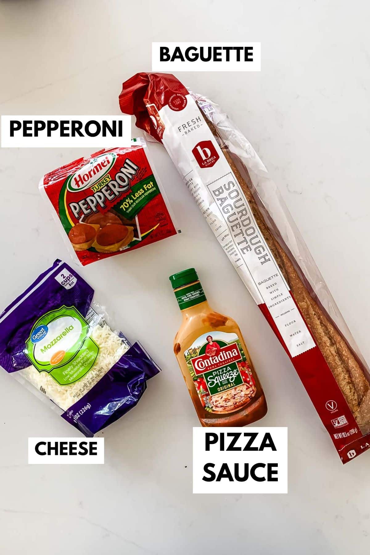 Image showing ingredients for making homemade pizza: a baguette, package of sliced pepperoni, a bag of shredded mozzarella cheese, and a bottle of pizza sauce. Each item is labeled with text indicating its name.