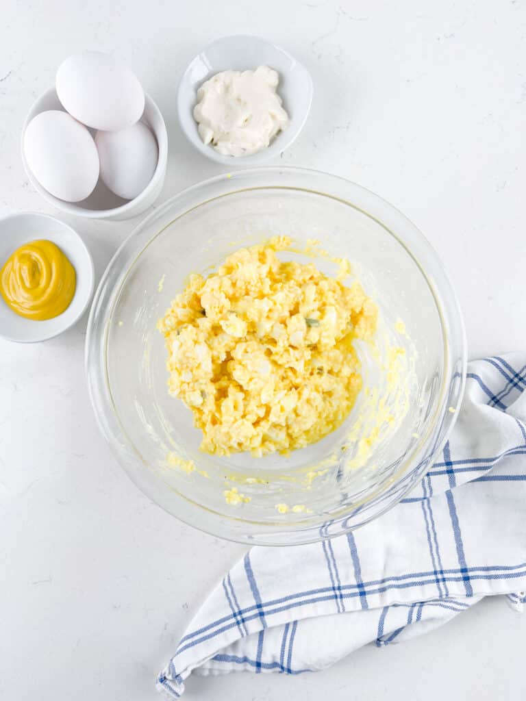 process shot of egg salad being made.