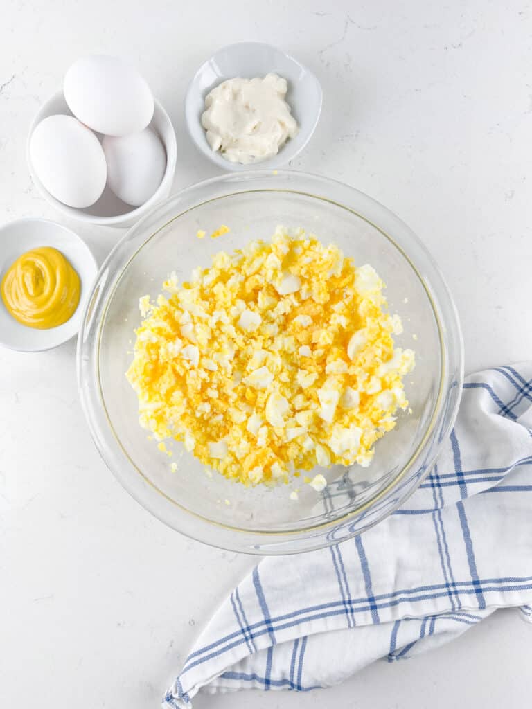 process shot of egg salad being made.