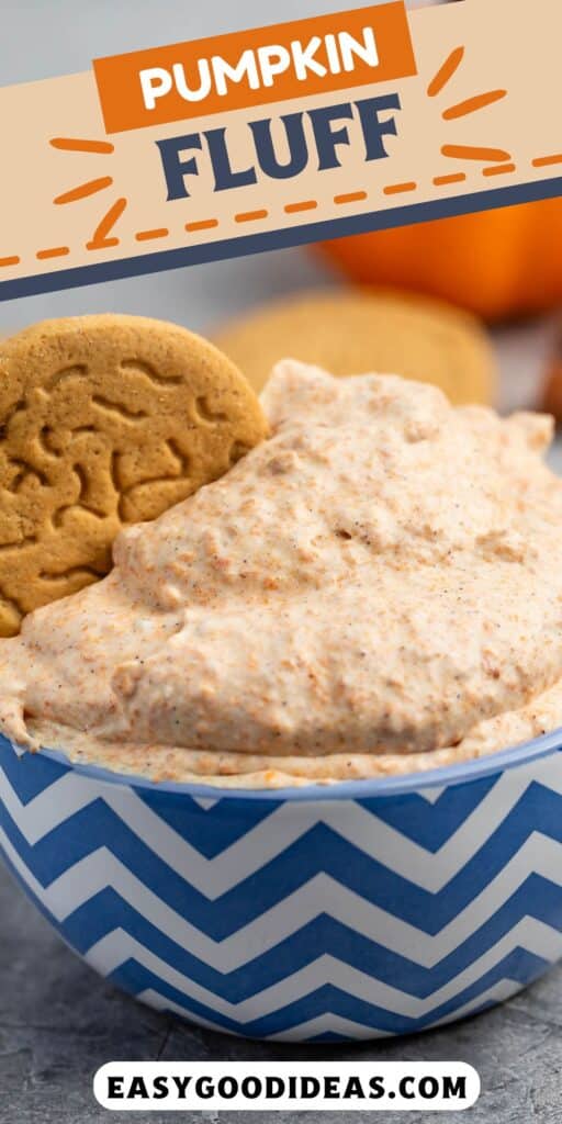 A bowl of pumpkin fluff topped with two cookies, set in a zigzag-patterned blue and white bowl. The text above reads Pumpkin Fluff and below is the website easygoodideas.com. Pumpkin and orange decorations are in the background.