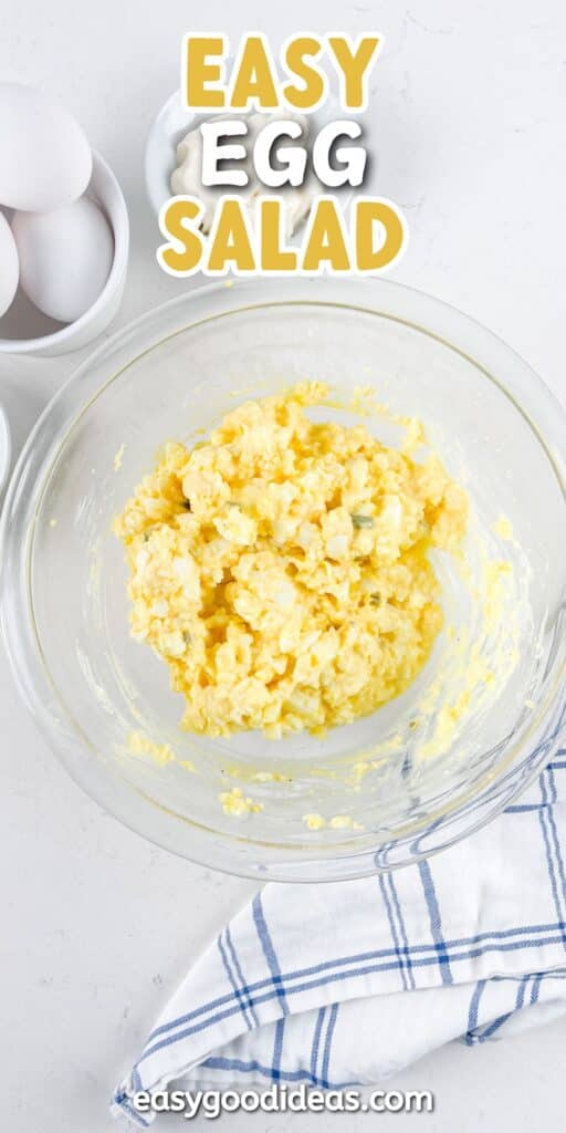 egg salad in a clear bowl with the name of the recipe written on the top.