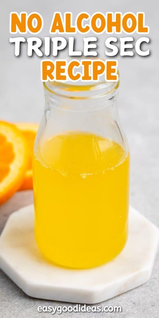 A small glass bottle filled with bright orange liquid sits on a white coaster. An orange slice is visible in the background. Text at the top reads No Alcohol Triple Sec Recipe and easygoodideas.com at the bottom.