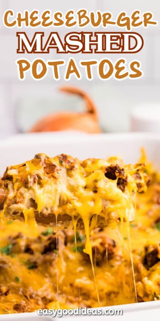 A close-up of cheesy mashed potatoes topped with ground meat and melted cheese, being scooped from a dish. The dish is labeled Cheeseburger Mashed Potatoes at the top.