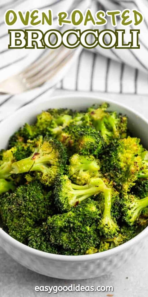 A white bowl filled with oven-roasted broccoli florets. The text Oven Roasted Broccoli is at the top, and easygoodideas.com is at the bottom. A fork and a striped napkin are in the background.