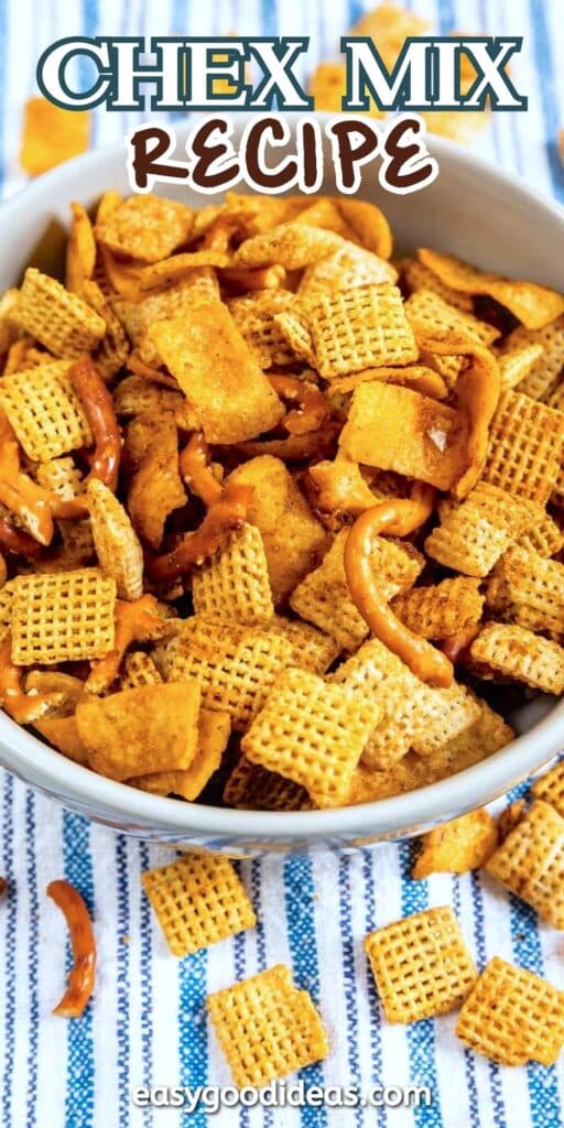 Bowl of Chex Mix filled with different snack pieces, including square cereal pieces and pretzels, placed on a blue and white striped cloth. Text at the top reads Chex Mix Recipe.