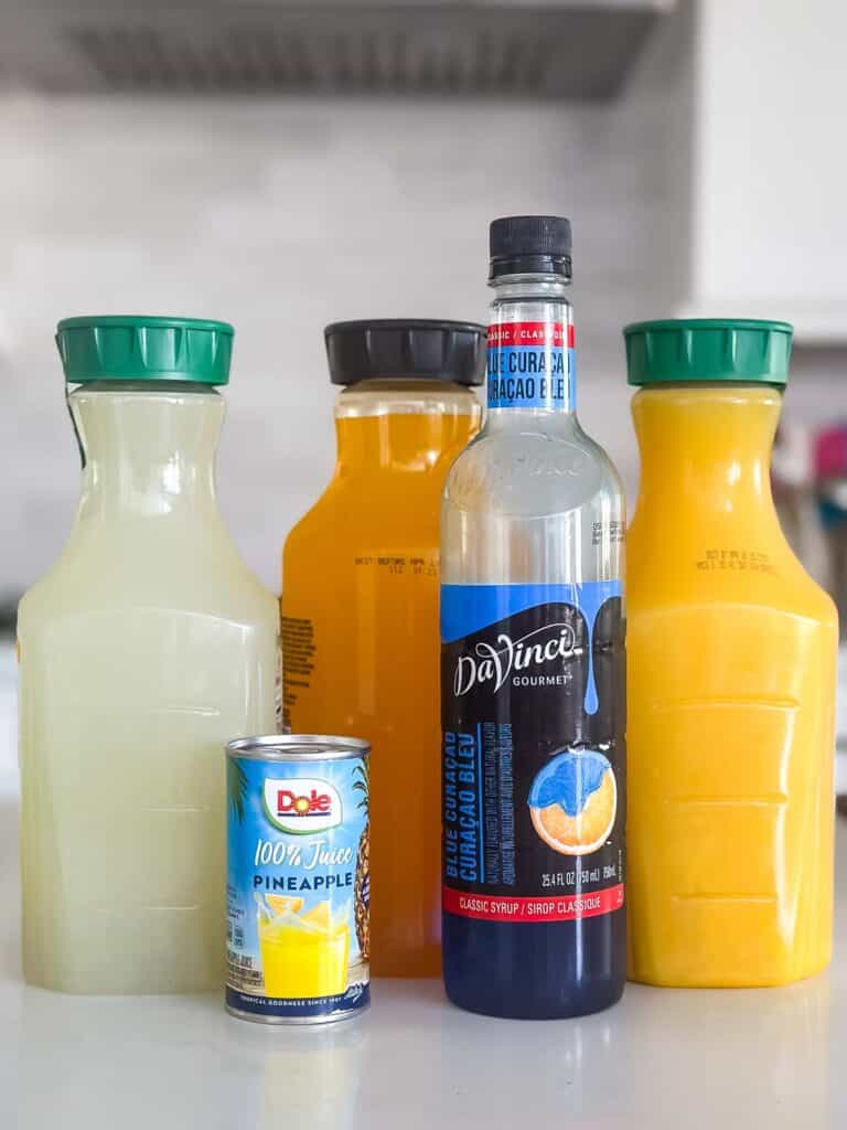 ingredients in the drink laid out on a white marble counter.
