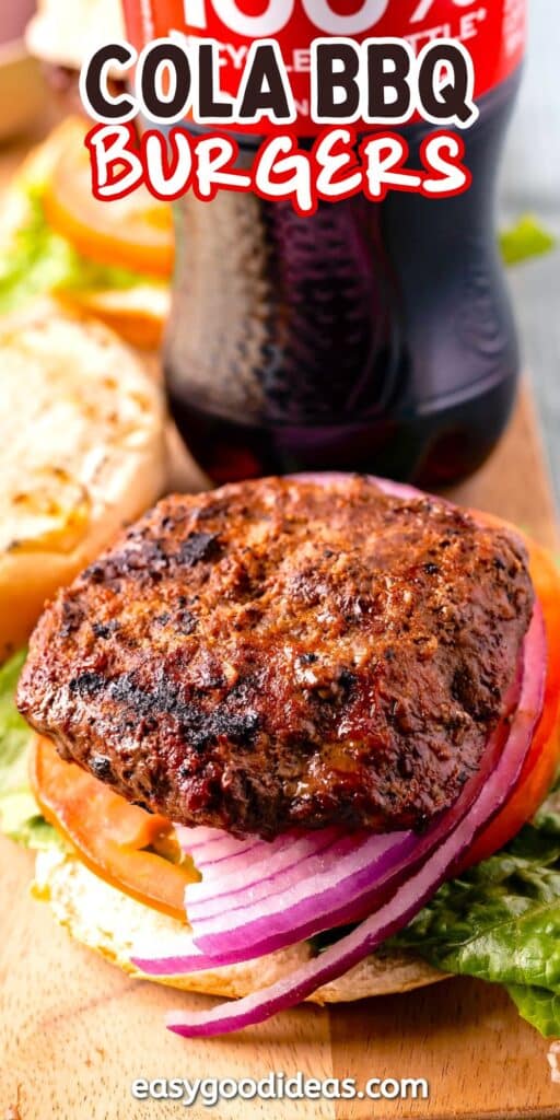 A grilled burger patty sits on a bun with lettuce, tomato, and sliced red onion. In the background, theres a bottle of Coca-Cola. The image has text at the top reading Cola BBQ Burgers and a website link at the bottom.