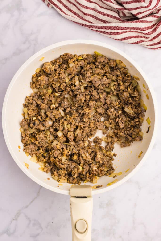 meat in a white pan.