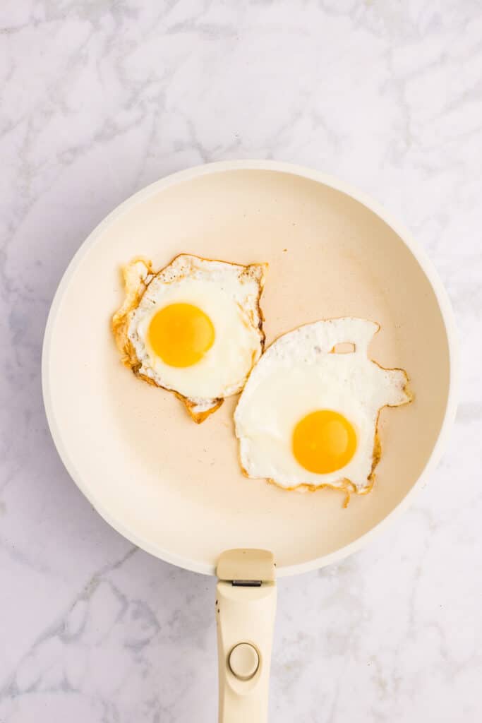 egg being baked in an off white pan.