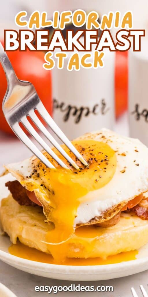 A fork cuts into a stack of waffles topped with crispy bacon and a sunny-side-up egg, with runny yolk spilling onto the stack. Salt and pepper shakers are visible in the background.