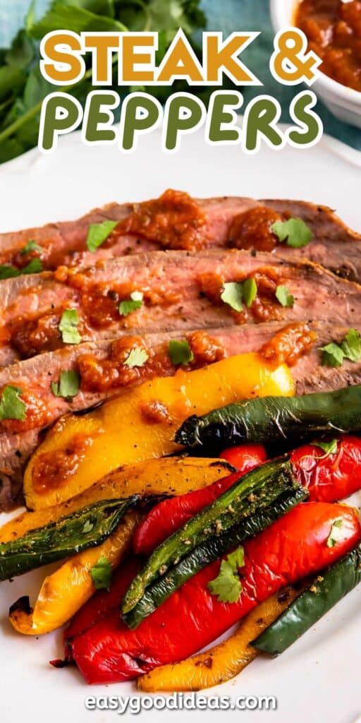 Sliced steak topped with sauce, served with roasted yellow, red, and green bell peppers on a white plate. The text “Steak & Peppers” appears at the top.