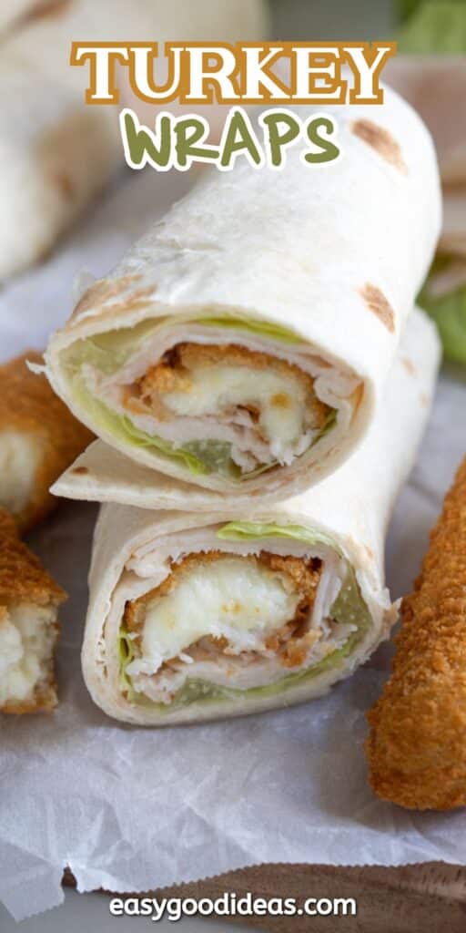 Close-up of two turkey wraps cut in half, showing layers of turkey, lettuce, and crispy breaded filling inside tortillas. Two breaded pieces are beside the wraps. Text at the top reads Turkey Wraps.
