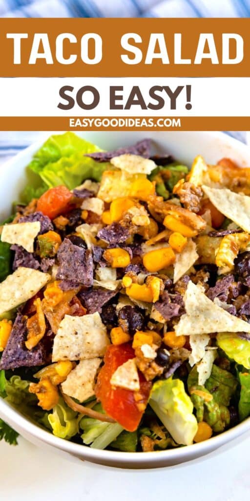 A bowl of taco salad topped with crushed tortilla chips, corn, tomatoes, and lettuce sits below a banner that reads “Taco Salad So Easy! easygoodideas.com.”.